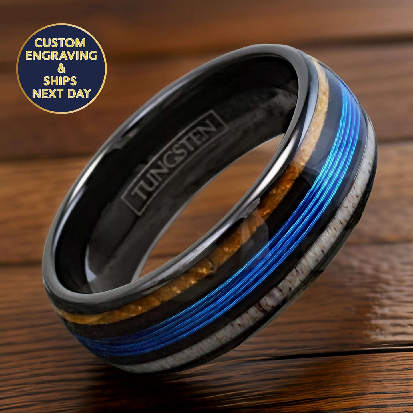 tungsten ring inlaid with white oak whiskey wood, deer antler, and blue fishing line