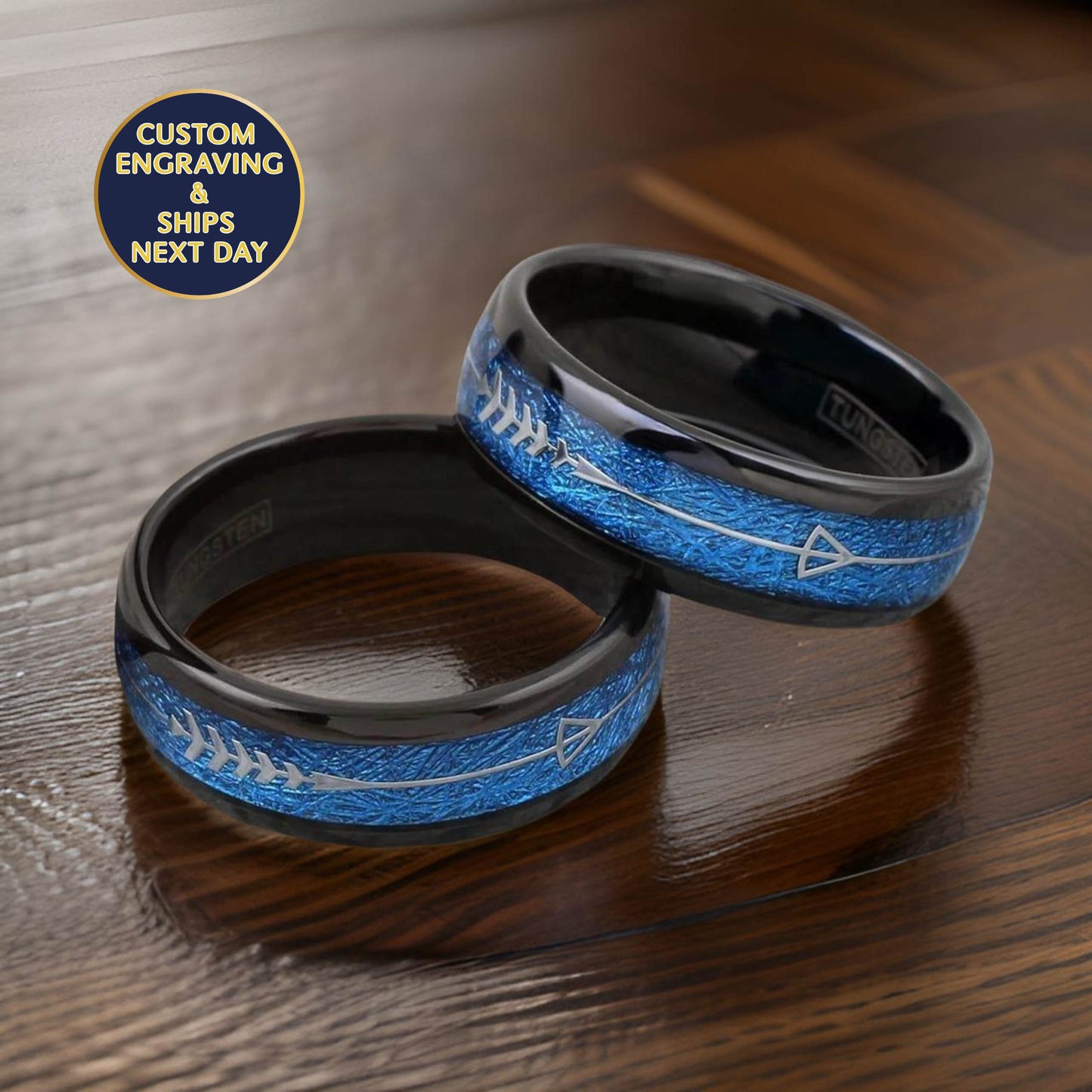 black wedding band made of tungsten metal and blue meteorite