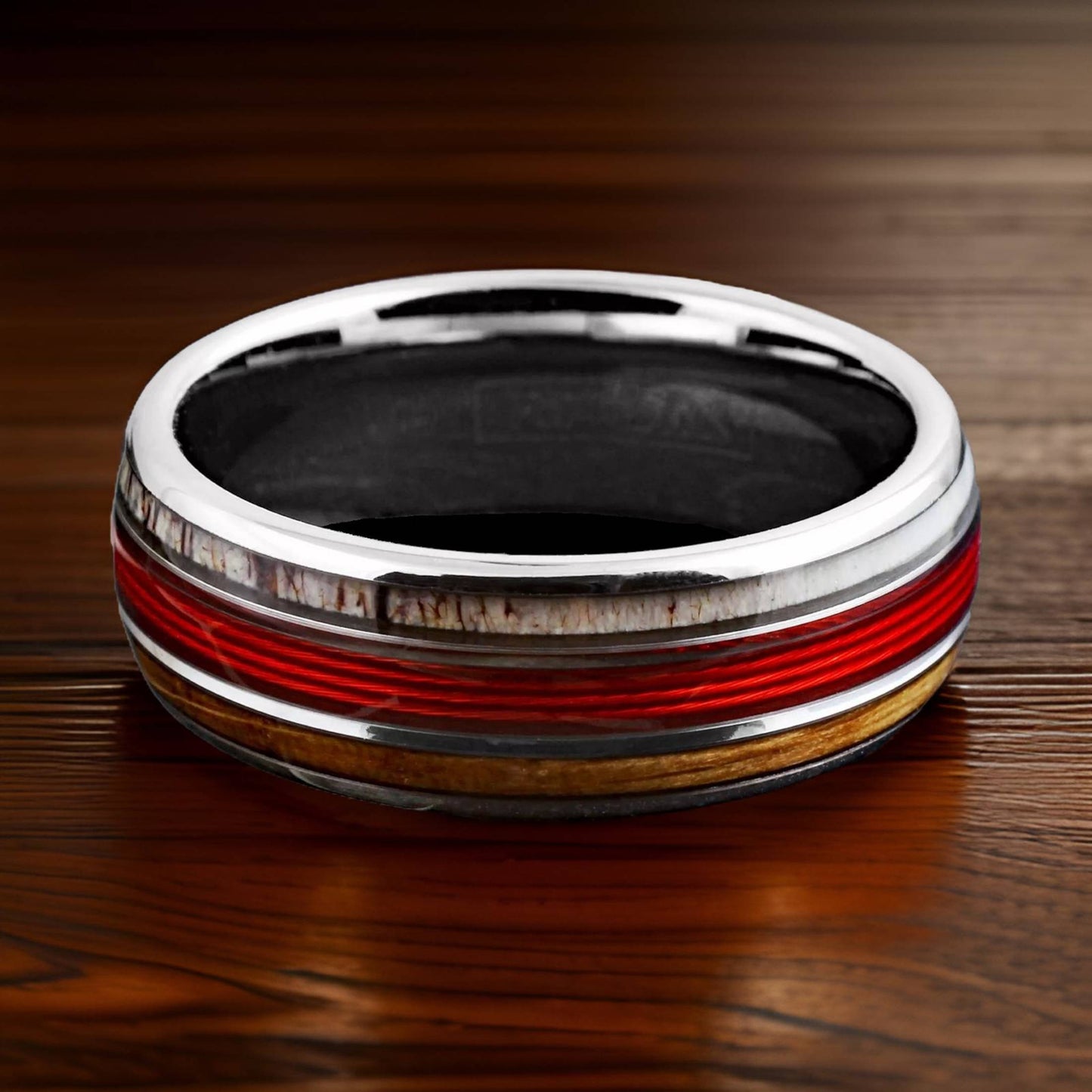 thin red line ring made of fishing line, deer antler, and whiskey barrel wood