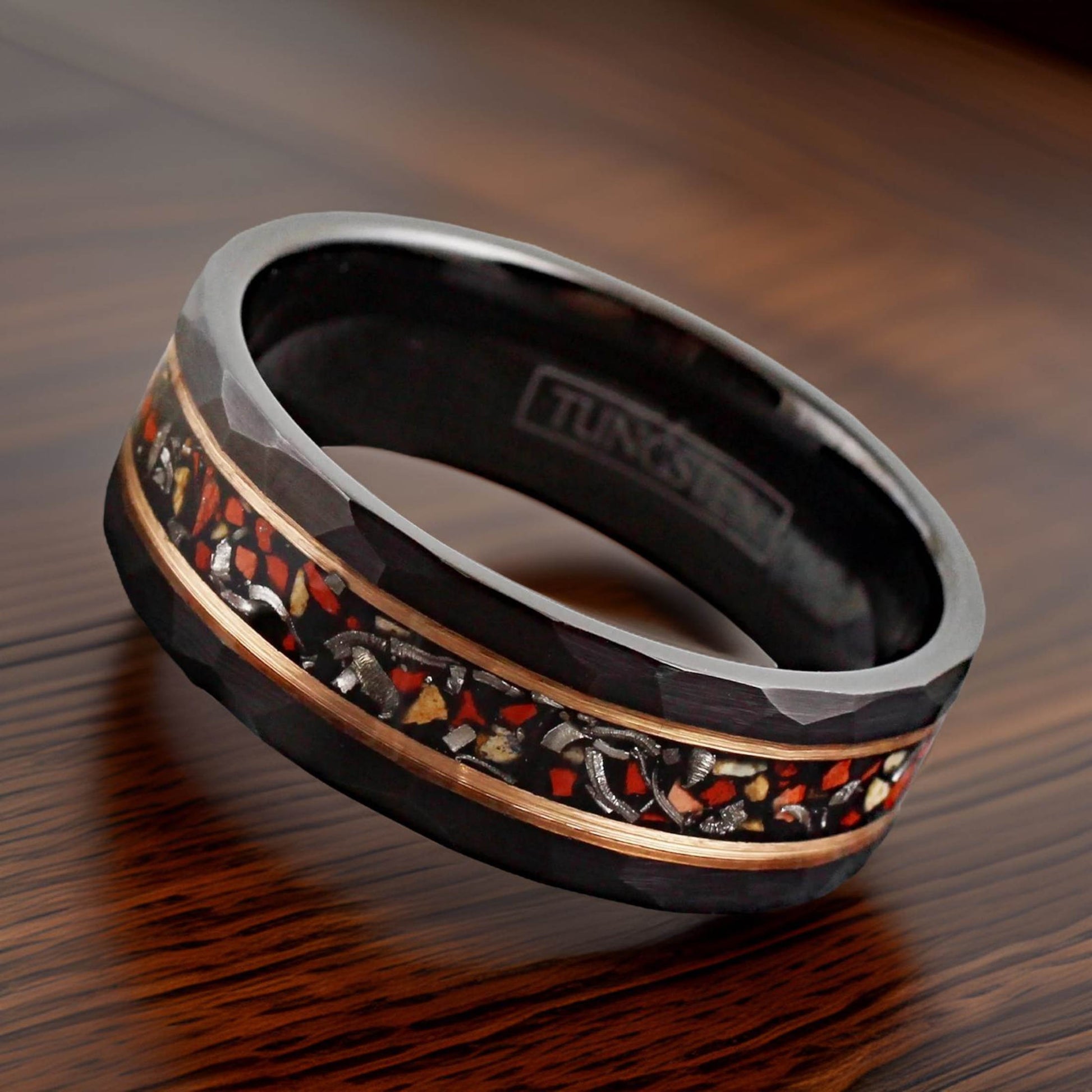 black tungsten band with fossilized dinosaur bone, meteorite, and rose gold stripes