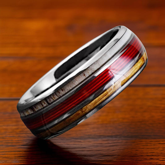 silver tungsten ring with red fishing line, antler, and whiskey wood inlay